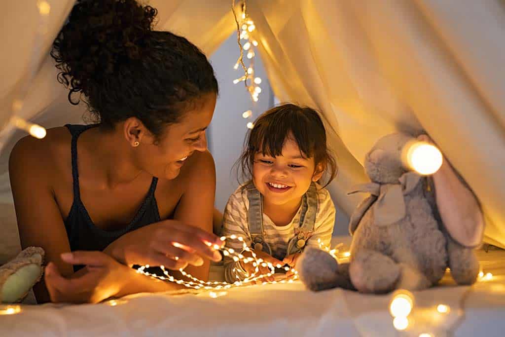 mother and daughter play in blanket tent in Prescott pest-free home